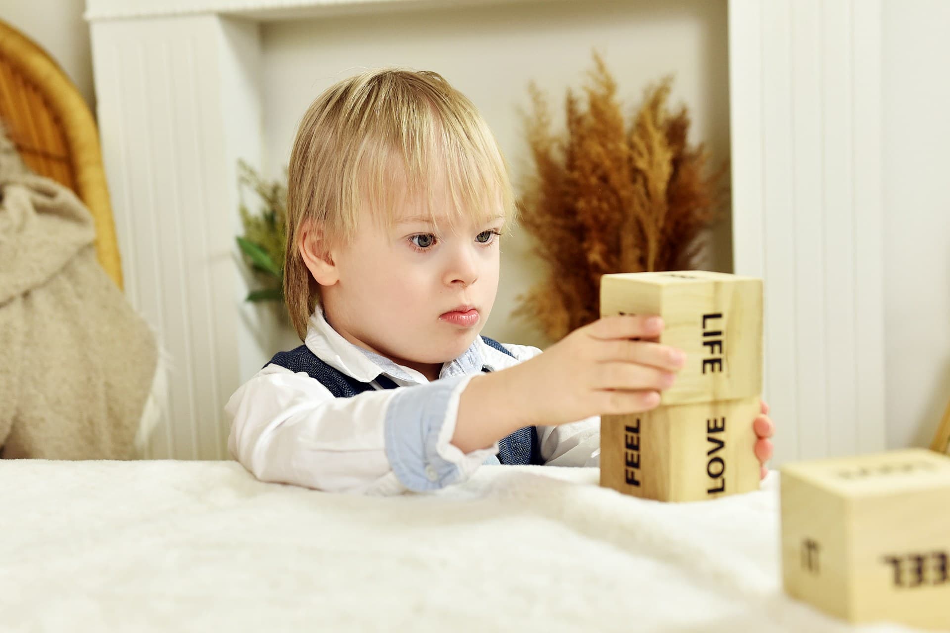 A young child engaged in early intervention play